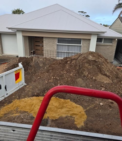 Soil Removal Adelaide service with excavation equipment removing excess soil from a residential construction site